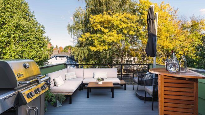 white sectional sofa on rooftop deck