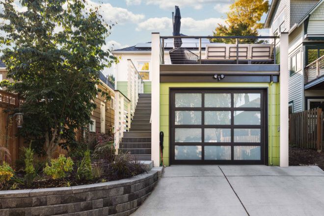 green garage with rooftop deck