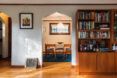 white arch doorway near bookshelves