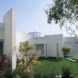 ancient columns in courtyard next to large white building