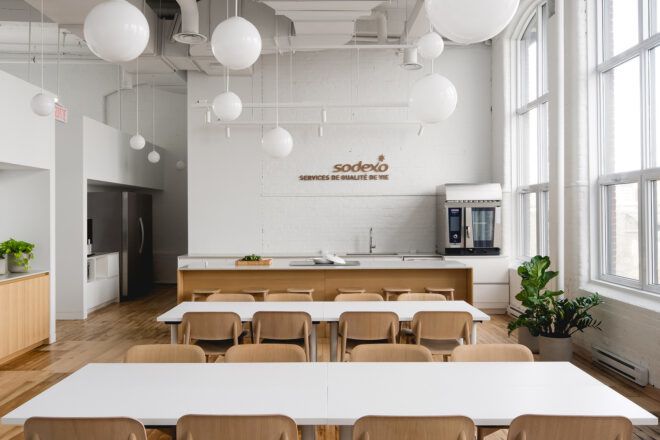 white dining tables with wood chairs in office kitchen