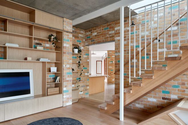 tan and teal brick wall with staircase
