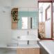 white bathroom with light wood cabinets