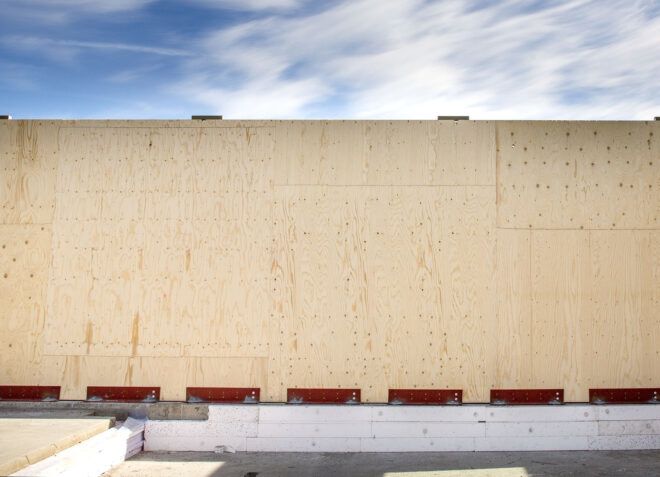 A wood wall being constructed.