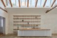 white desk with wood shelves behind it