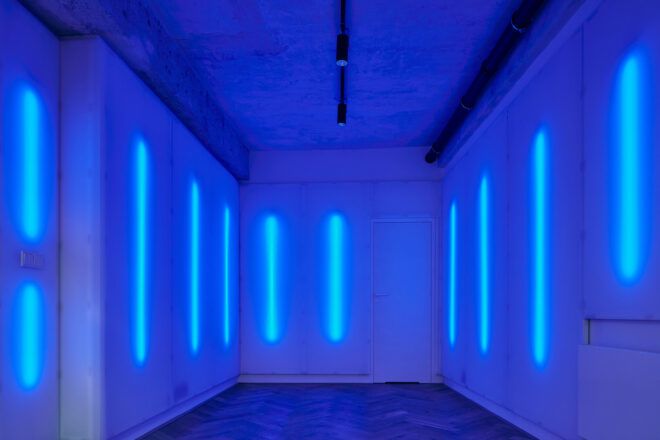 white room lit up with bright blue lights