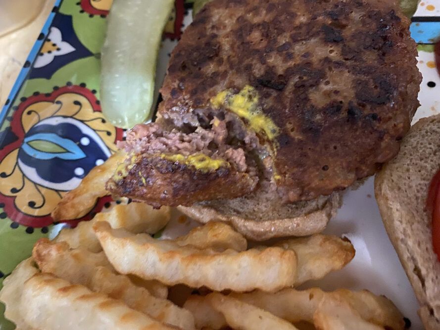 close-up of juicy pink interior of vegan burger
