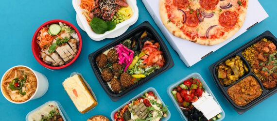 plastic takeout containers on blue background
