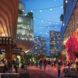 rendering of buildings lit up at night