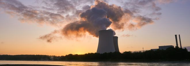 nuclear power plant cooling towers at sunset