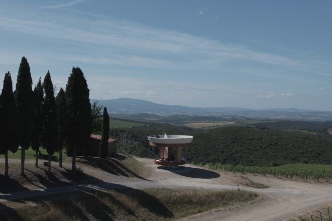 Casa Ojalá flanked on the left by trees and on the right by a valley.