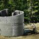 The curved concrete home being constructed.