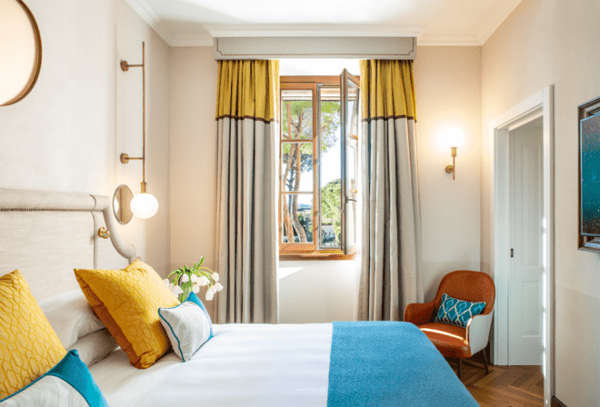white and blue bed in guestroom