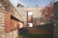 An L-shaped intersection on the home's stone exterior.