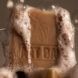 soap suds on brown bar of natural soap