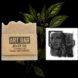 beige bar of soap next to art print with two faces