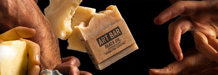 hands grabbing for natural bars of soap