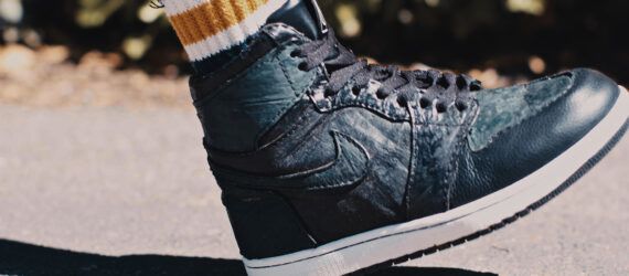 A dark teal sneaker.
