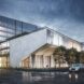 rendering of concrete and glass office building lit up at night
