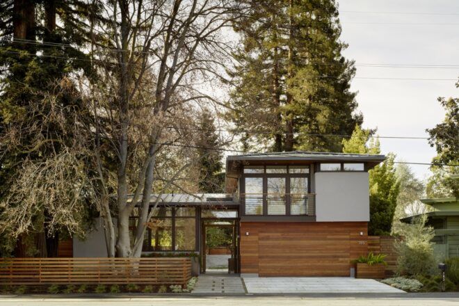A streetview of the home, showing two pavilions on the ground level and a third structure for the second story.