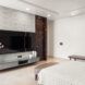 white bed facing mounted flat screen TV