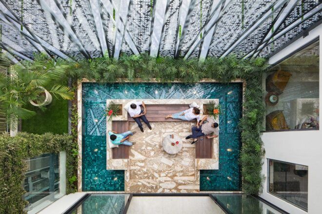aerial view of patio in center of small cooling pool in outdoor courtyard