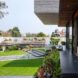 doors opening to grassy outdoor courtyard