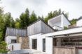 courtyard connected to white and wood homes