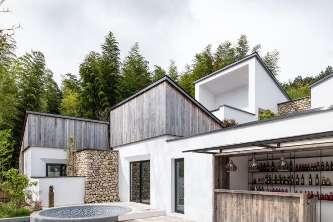 courtyard connected to white and wood homes