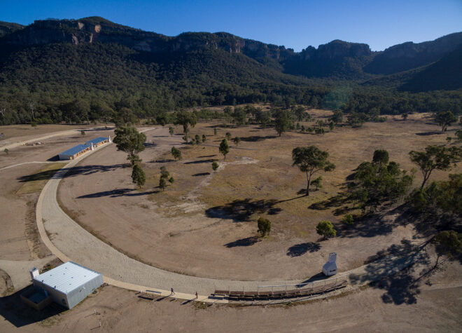 buildings arranged along a crescent-shaped site