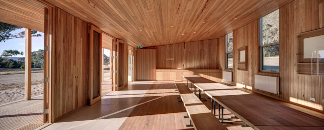 school room with wood floors, walls and ceilings