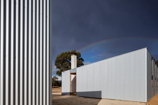 rainbow above metal school building