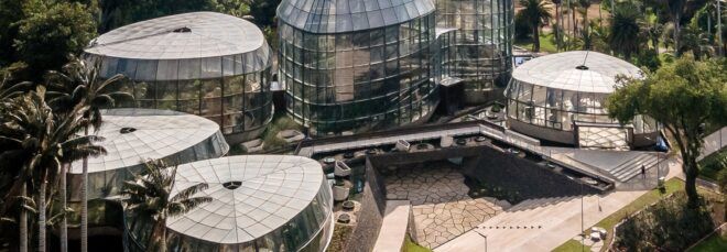 An elevated view of the botanic garden greenhouse buildings.