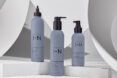 blue shampoo and conditioner bottles