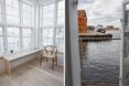 chair near houseboat windows revealing harbor views