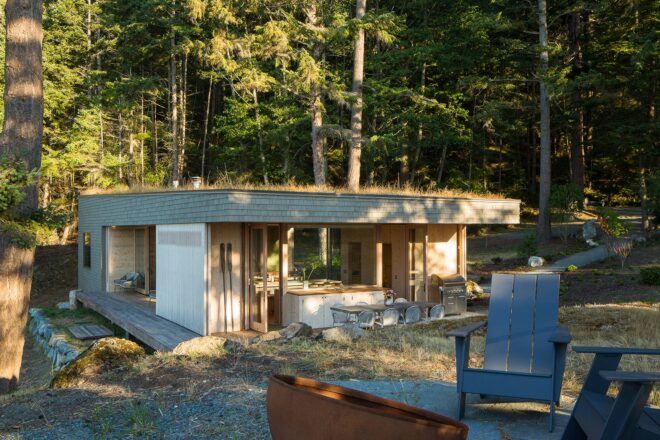 wood home with grassy roof