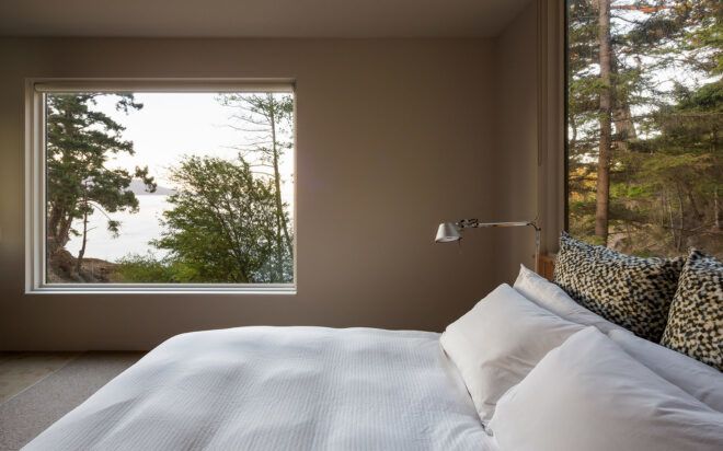 large white bed near large window