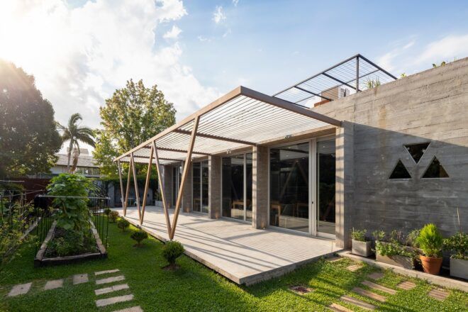 A garden connected to a covered patio.