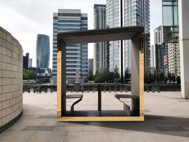rendering of black and gold office pod on a building roof