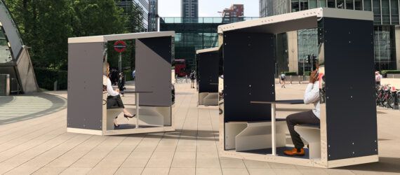 rendering of black and white structures with open sides in a city center