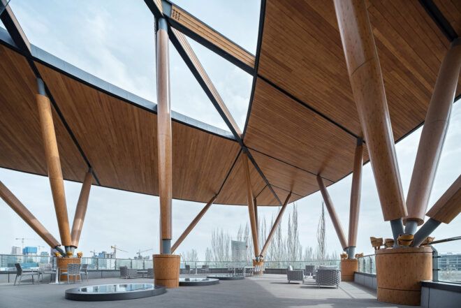 A wooden pavilion on the top floor of the building, overlooking the city.