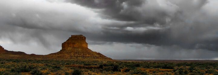 A desert with a cloudy, dark sky in New Mexico.