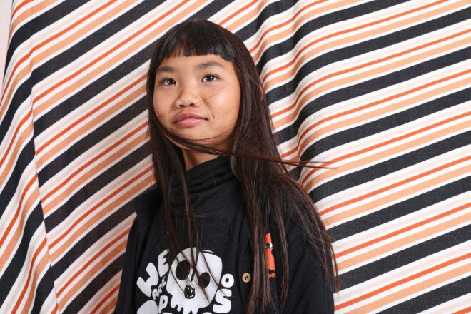 kid wearing black and white hoodie