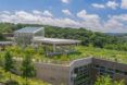 roof of building covered in plants and solar panels