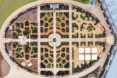 A bird's-eye view of the World Food Garden, showcasing an intricate design with a roundabout in the middle that branches of in four directions to different sections of the garden.