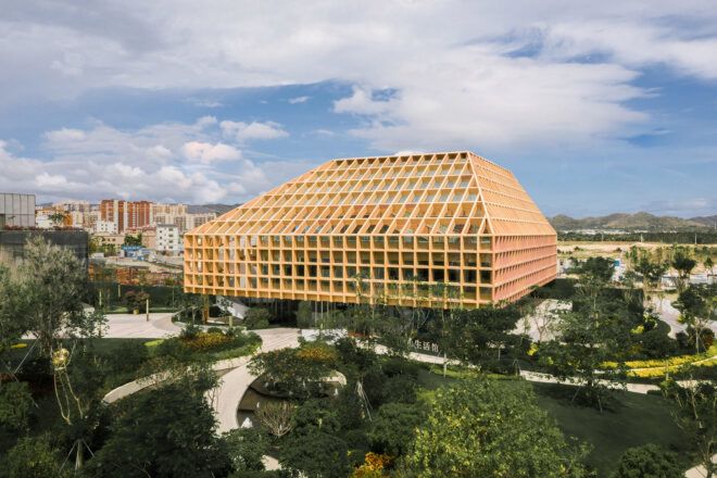 large building with wood grid roof