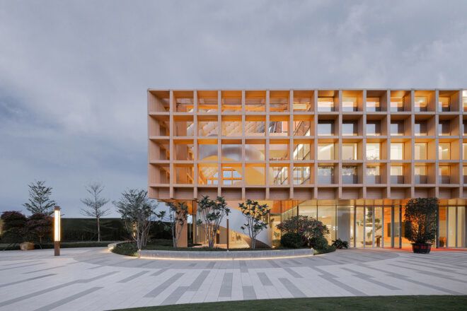 outdoor courtyard next to wood and glass building