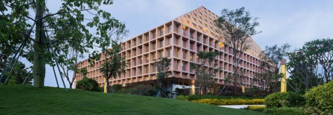 glass building with wood grid facade