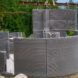 The curved concrete home being constructed.