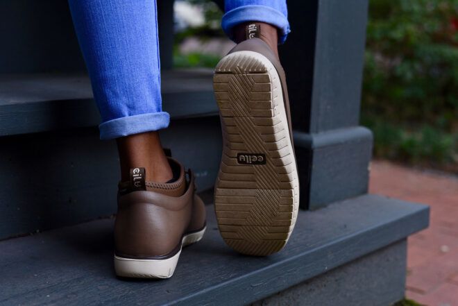 person wearing brown waterproof boots